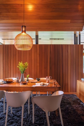 Marine Parade House: the timber-clad dining area.
