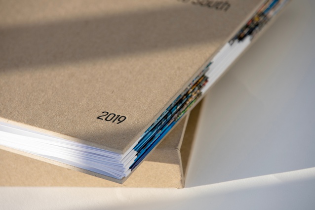 A view of the cover with a glimpse of the stacked and folded pages.