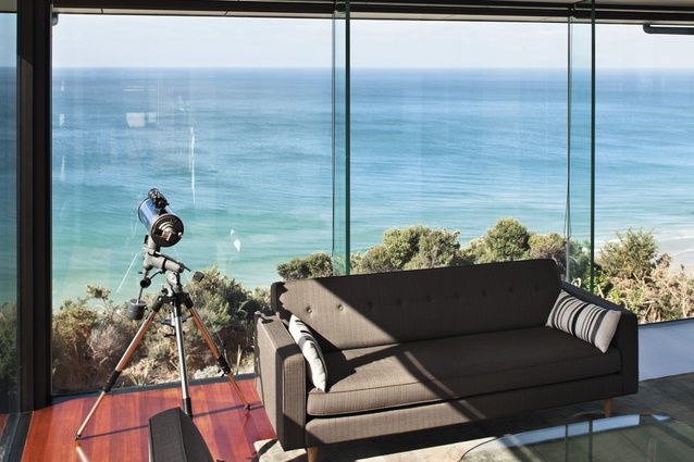Full-height glass walls offer sweeping views from living area.