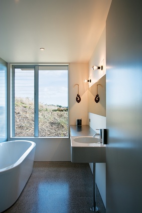 The bathroom at the guest (south) end of the house. The house’s concrete floor retains heat.