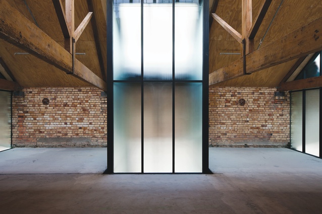 The sandblasted glass lightwells that eventually terminate in the groundfloor laneway also bring illumination to the second-floor space.