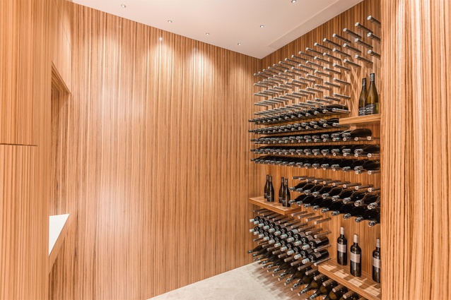 The temperature-controlled wine cellar, finished in zebrano timber.