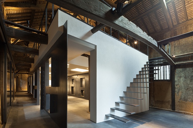 Fukuchiyo sake brewery in Japan by yHa architects. The building is of historical significance to its prefecture, so the exterior could not be altered. Instead, the interior was renovated.