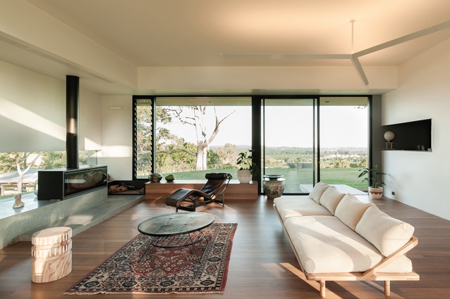 A north-facing concrete pergola and deck off the living room take advantage of the winter sun.