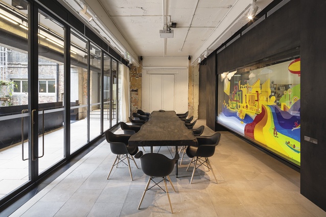 The boardroom opens onto the building’s main circulation and provides views out onto a central plaza.