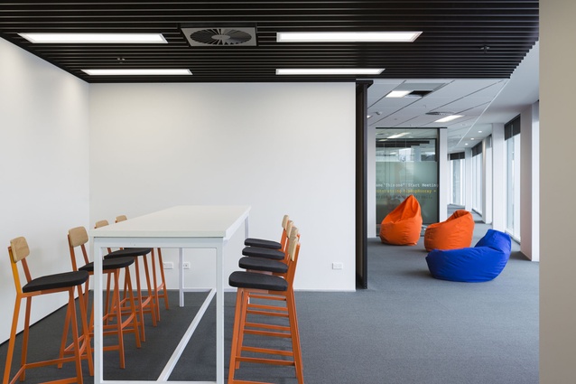 The contrast of stark white walls with splashes of colour brings variety and interest to the workplace.
