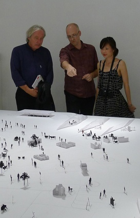 Andrew Barrie and Melanie Pau explain the installation to Steven Holl.