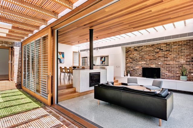 Timber beams, brickwork, louvres and pavers create a striking patchwork of patterns and textures.