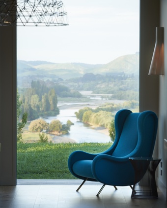 Secto wall light by Simon James makes this the perfect seat for reading. The teal-blue Arflex ‘Sir’ chair (designed in 1951 by Marco Zanuso) is available from Studio Italia. 