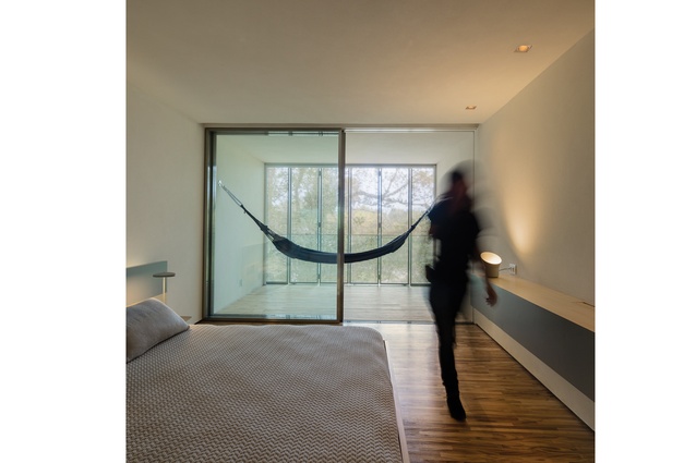Each bedroom has a small covered deck with Paola Lenti hammocks. 
