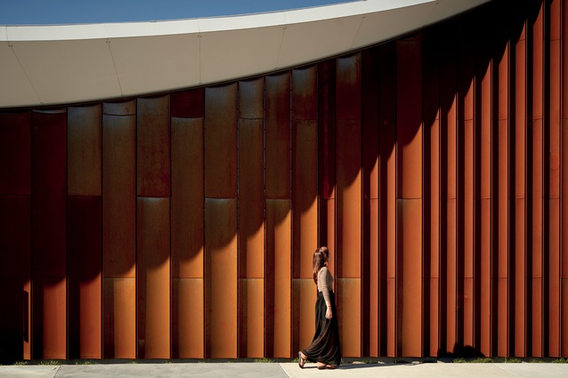 Cold-rolled, curved Corten steel is used for the cladding, as a reference to the pleated shawl worn by Sisters of Mercy founder Catherine McAuley.