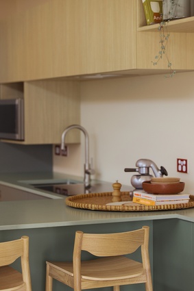 The generous kitchen includes a warm and inviting breakfast bar.