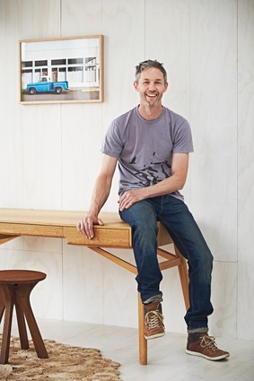 George Harper sits on the Tuki desk, with Lyssna stool in the foreground.