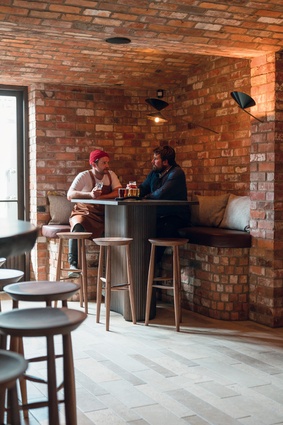 Recycled bricks create a sultry, masculine space in the Alibi bar.