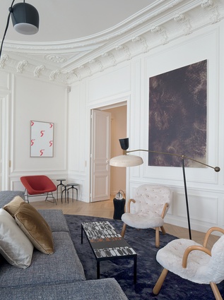 Classic elements and colours are mixed with a range of eclectic furnishings and colours in this  Parisian apartment. 