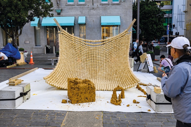 pre:fab platform’s Calycore Canopy brings natural materials into the concrete city with a biodegradable installation as an overhead net and sculptable earth inviting public interaction.