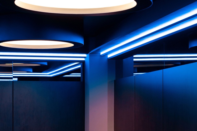 Custom made light fittings and mirrored top panels to the walls creating a feeling of spaciousness.