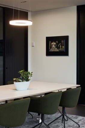 The natural palette and accents of green are carried throughout the office space.