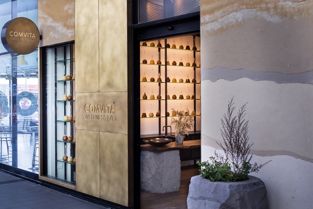 The warmth of honey and the hive are communicated on the exterior through the use of antiqued brass and layered earth render with subtle debossed branding.