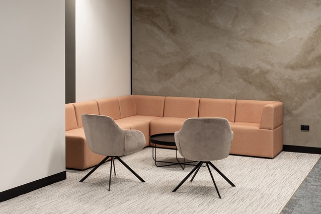 Communal areas in the 12th-floor space feature high-quality fabrics and finishes. 