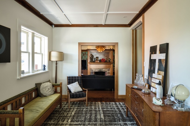 The panelled ceiling and timber floors ensure the new addition merges with the original.
