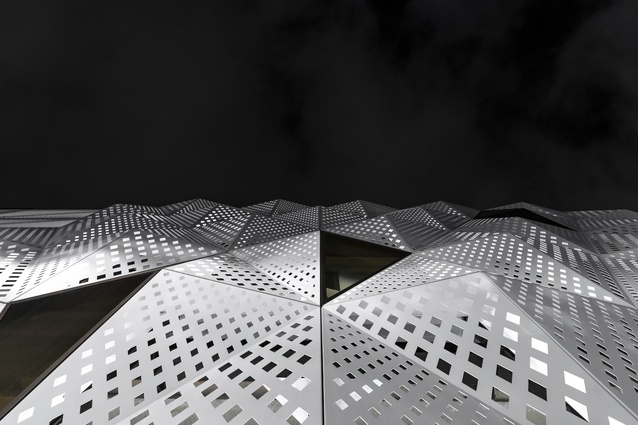 The perforated-metal screens are made up of an array of folding geometrical triangles. 
