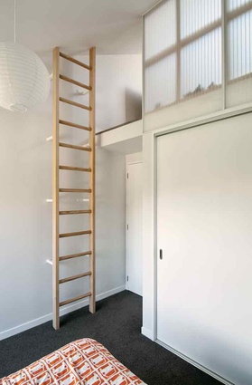 A ladder leads to a mezzanine space in both the children's bedrooms. 