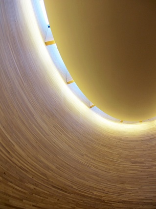 A halo of natural light surrounds the chapel’s suspended ceiling.