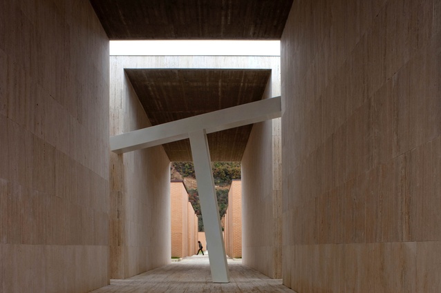 Gubbio cemetery, Italy by Andrea Dragoni. 2011. A cemetery extension that features rows of huge travertine walls with site-specific artworks slotted in between.