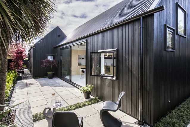 Urban Cottage, Christchurch, by CoLab Architecture. 2016. The home's exterior is stained in Resene Waterborne Woodsman CoolColour™ tinted to ‘Pitch Black’. 