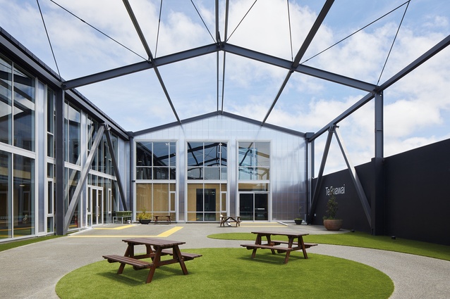 The existing roofing was removed for the outdoor courtyard while the warehouse structure remains.