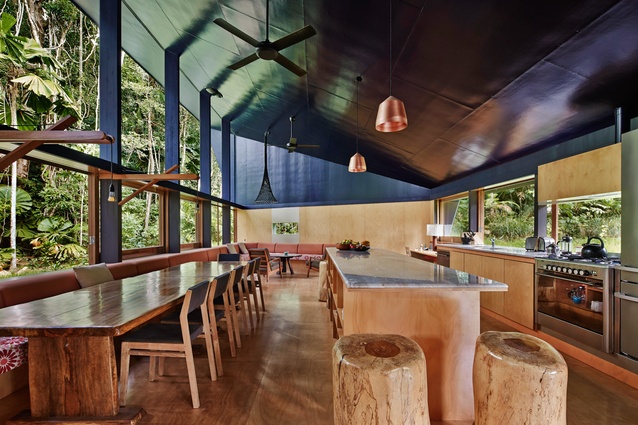 Hoop pine plywood lines the walls and floors of the open-plan kitchen and lounge. The dining table was made from a quandong tree that fell naturally in the nearby rainforest.