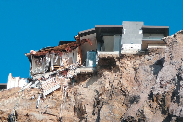 A brand new earthquake-damaged home; the other half of it is 40 metres below at the bottom of the cliff.