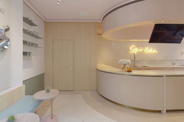 The cursive writing of Spiritea’s neon name mirrors the sinuous ceiling lines and retro-esque furnishings.