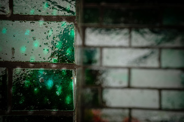 The green-glazed Italian bricks of The Greenhouse have been noted for their startling ability to change appearance under different light conditions.