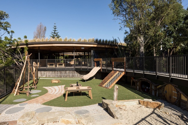 The outdoor playground includes hobbit holes and creative entry and exit routes.