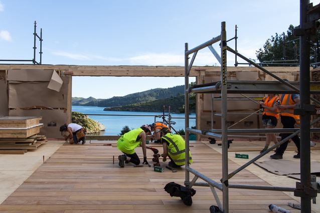 Kat Hebden, Terese Fitzgerald, Georgina Gray and Elspeth Gray fixing the pre-cut decking for the internal breezeway at the end of Day 2 of assembly. Garapa decking kindly donated by 				Rosenfeld Kidson.