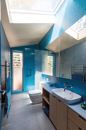 The bathroom’s mosaic tiles are Deanna’s favourite blue.
