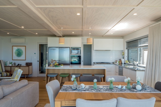 The living and kitchen space occupies the front of the house and features a combination of soft tones, reminiscent of sand dunes, sea and sky.