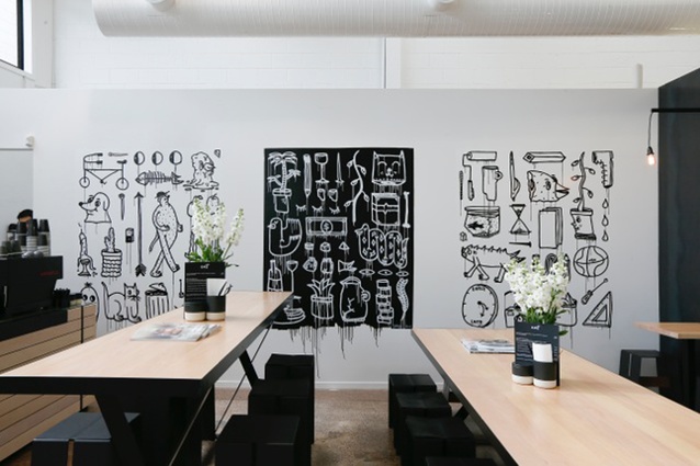 The black and white art wall is created by street art collective BMD.