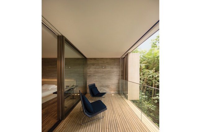 Each bedroom has a small covered deck with Sand armchairs.
