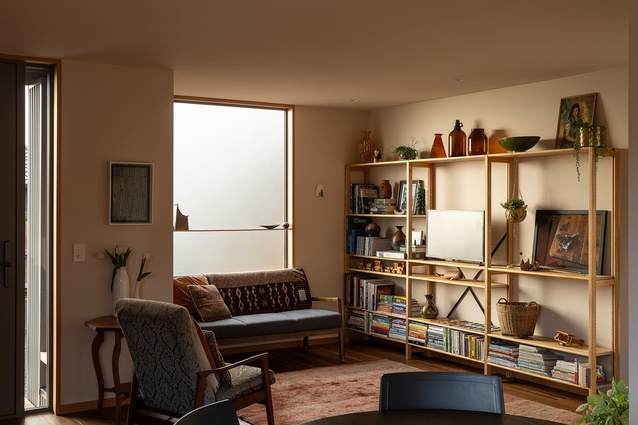 The living room with repurposed Lundia shelves and all the well-loved personal treasures.
