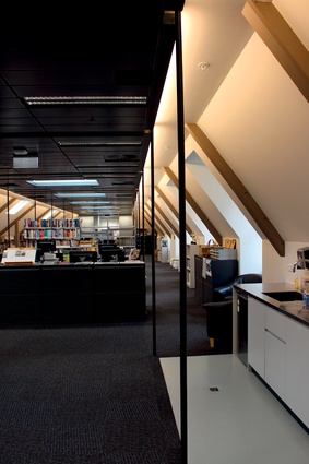 The refurbished interior is now an open-plan office space. 