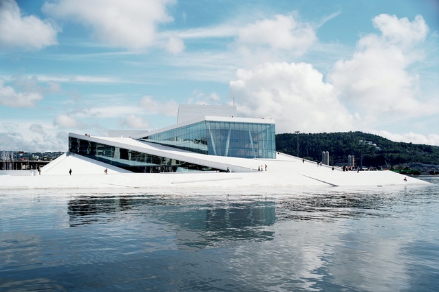 In the winter months, snowdrifts alter the form of Snøhetta’s Norwegian National Opera and Ballet building; ice often forms along the ramped roof.