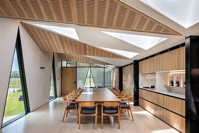 Boardroom or tasting table, this space offers views out to the lake or inwards to the barrel room.