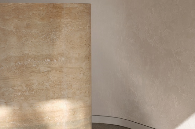 A honed travertine counter sets the tone with its natural, timeless beauty. 