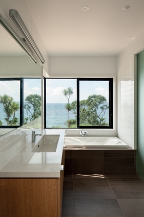 Ensuite bathroom with a view over the ocean.
