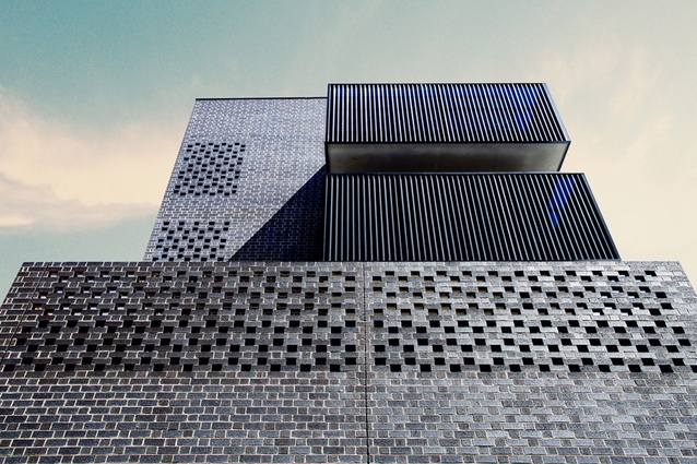 Ari Apartments by Ola Studio, Melbourne. The black bricks of this mixed-use building create perforated patterns to provide privacy and introduce natural light into the interior.