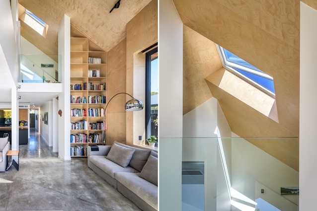 Birch ply walls and skylights give the double-height living area an airy feel, anchored by the concrete floors.