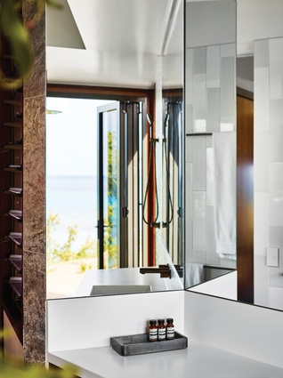 Mirrored surfaces are used to retain a connection with the outdoors, but also to give the impression of generous space.